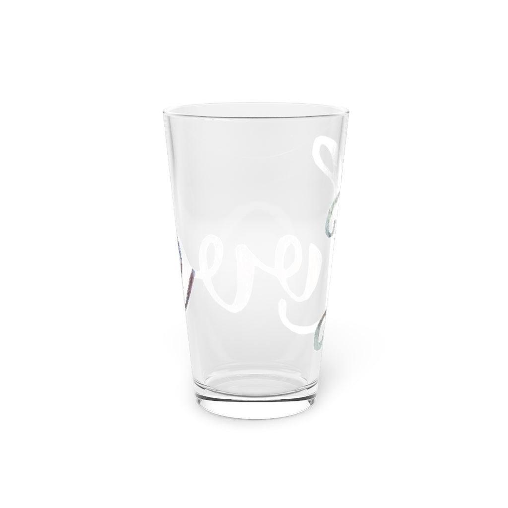 A clear 16oz Love Pint Glass showcasing a personalized design, perfect for beverages.