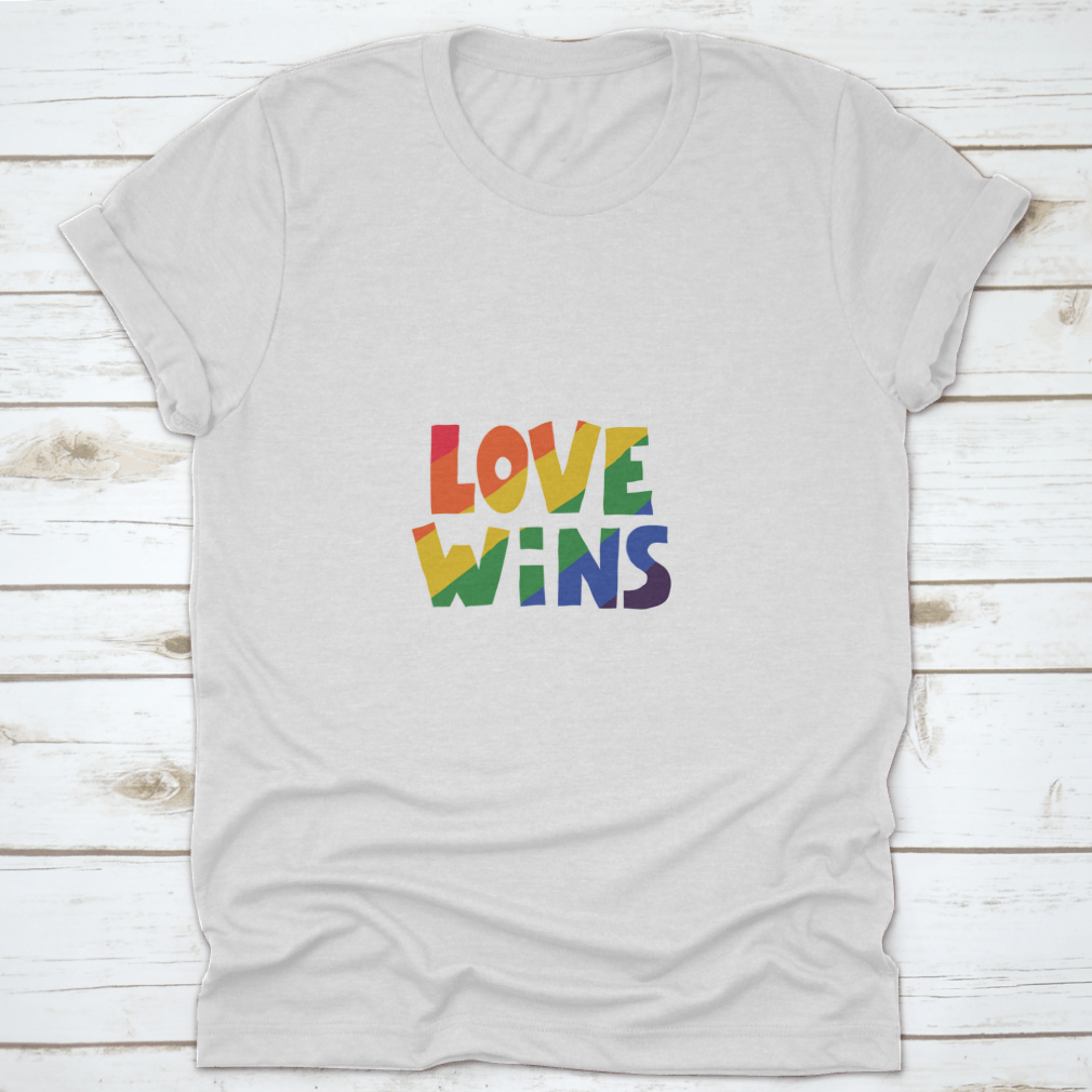 A stylish shirt featuring 'Love Wins' lettering in vibrant rainbow colors, symbolizing love and inclusivity.