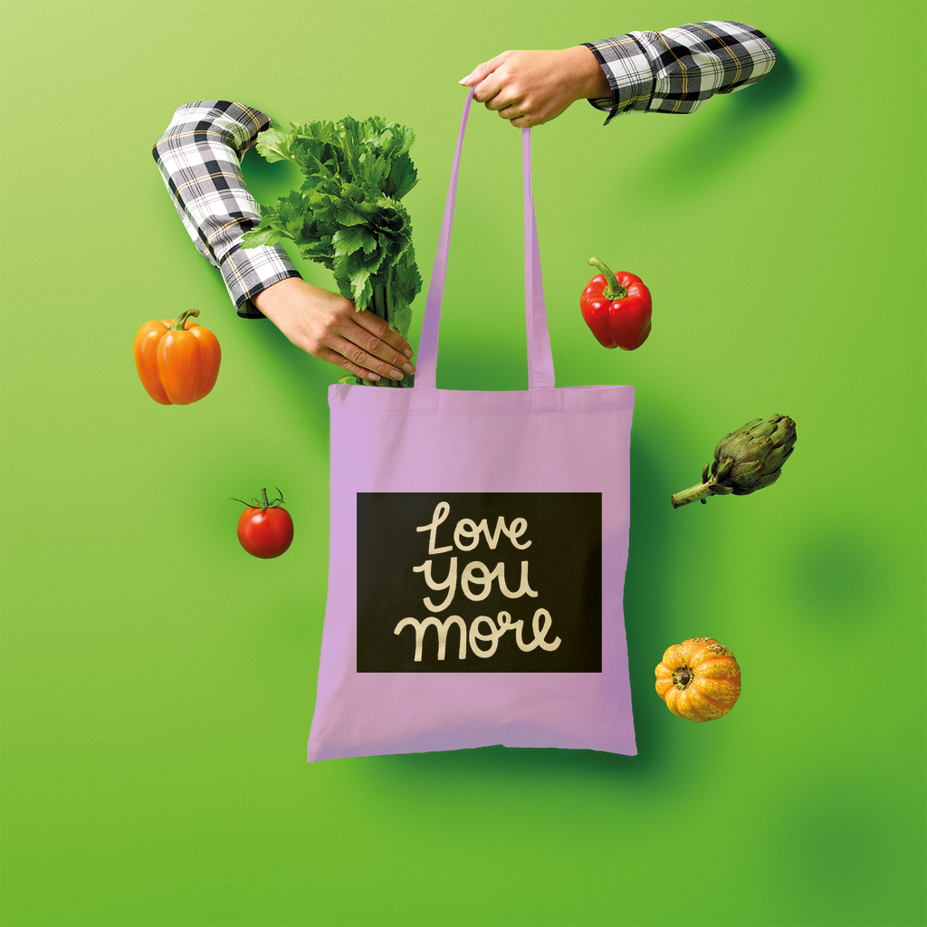 Love You More Shopper Tote Bag made of 100% cotton, featuring a spacious design and comfortable shoulder straps, ideal for eco-friendly shopping.