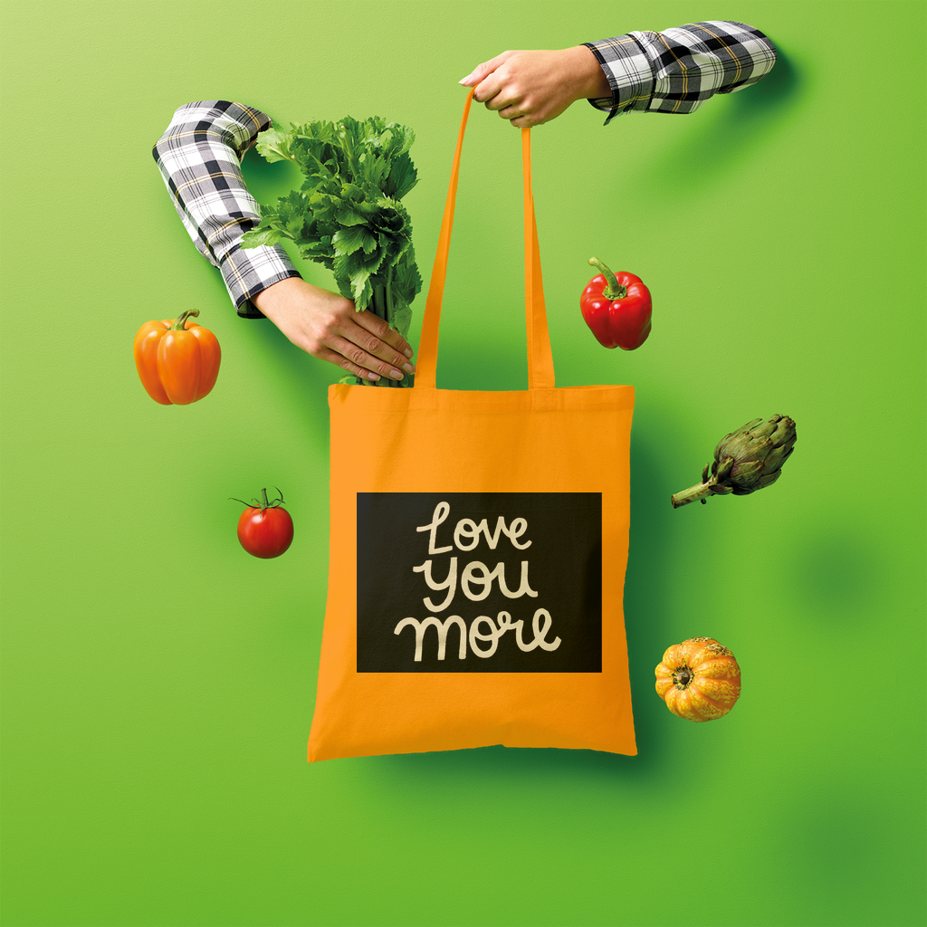 Love You More Shopper Tote Bag made of 100% cotton, featuring a spacious design and comfortable shoulder straps, ideal for eco-friendly shopping.