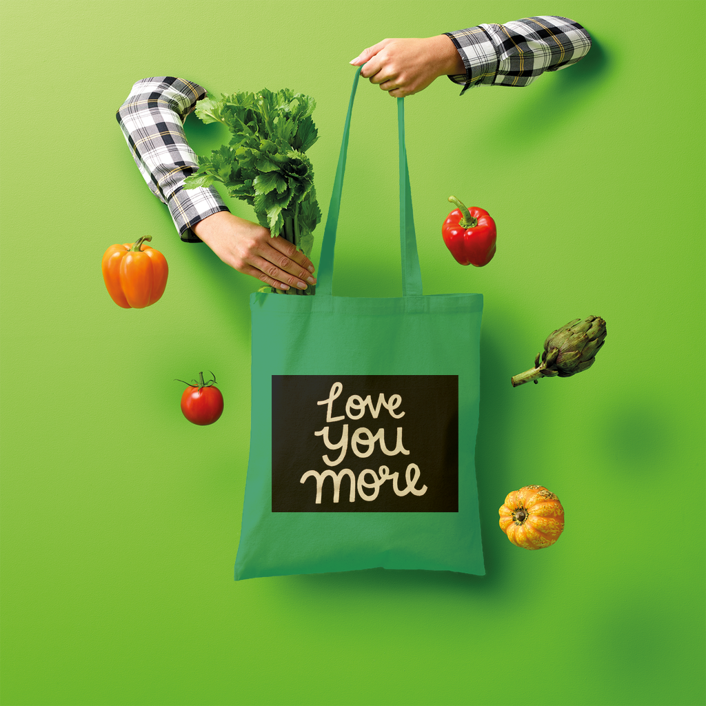 Love You More Shopper Tote Bag made of 100% cotton, featuring a spacious design and comfortable shoulder straps, ideal for eco-friendly shopping.