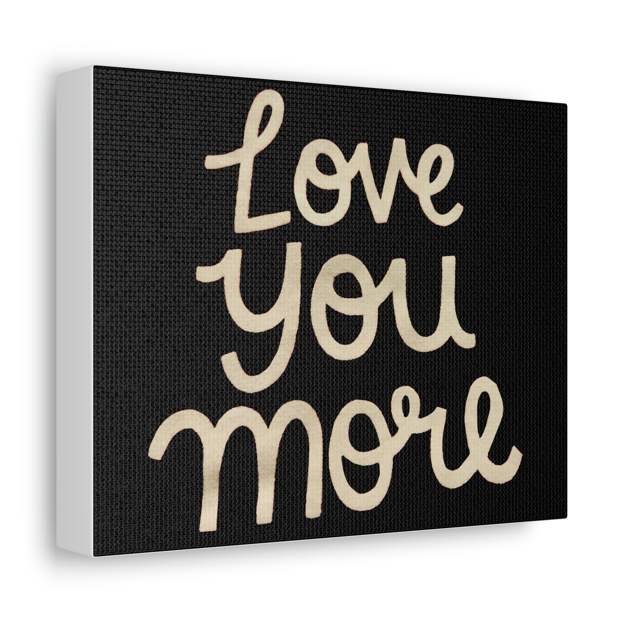 Love You More Stretched Canvas art piece featuring a heartfelt message, elegantly stretched on a wooden frame.