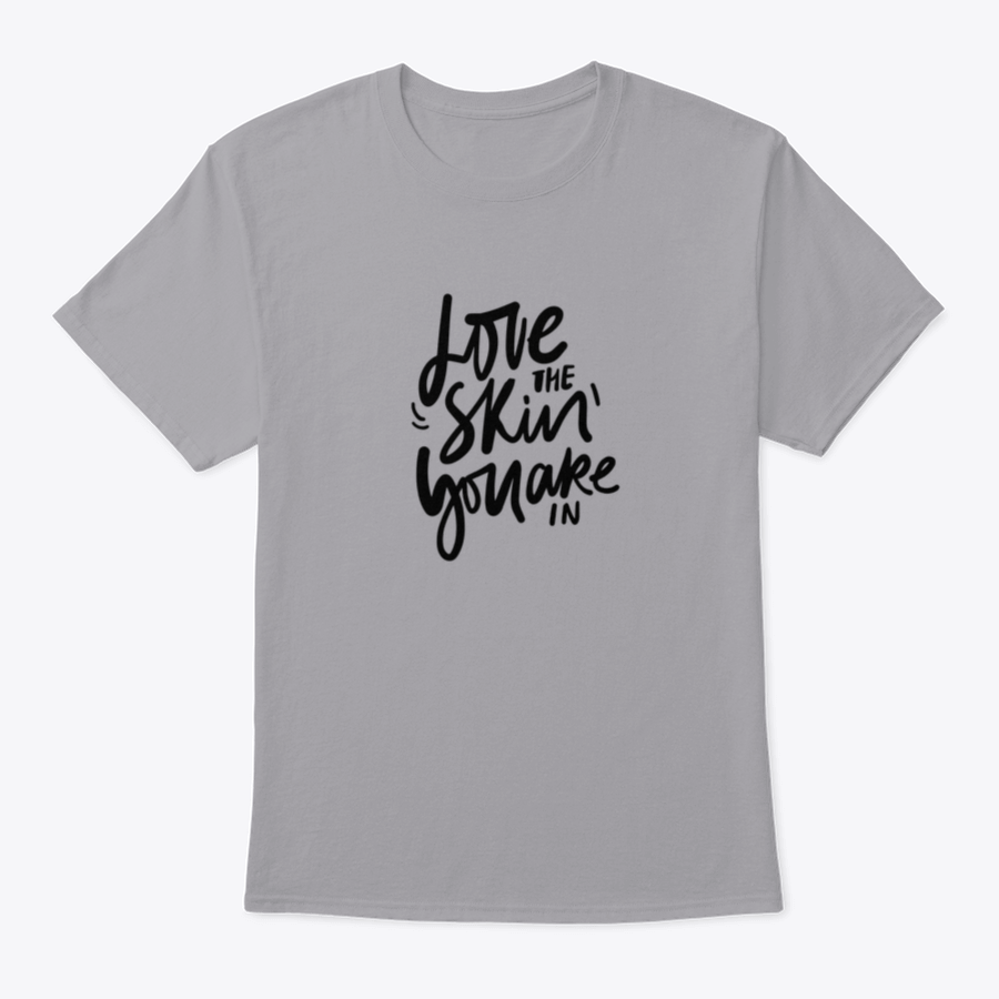 A stylish calligraphic shirt design featuring the quote 'Love Your Skin You Are In', made from soft cotton fabric.