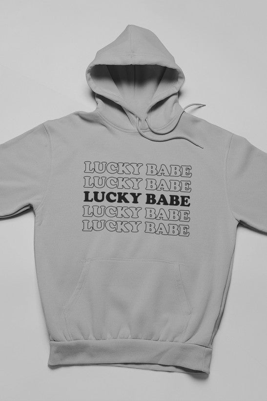 Lucky Babe Hoodie featuring unique artistic designs, adjustable hood, and cozy fleece lining.