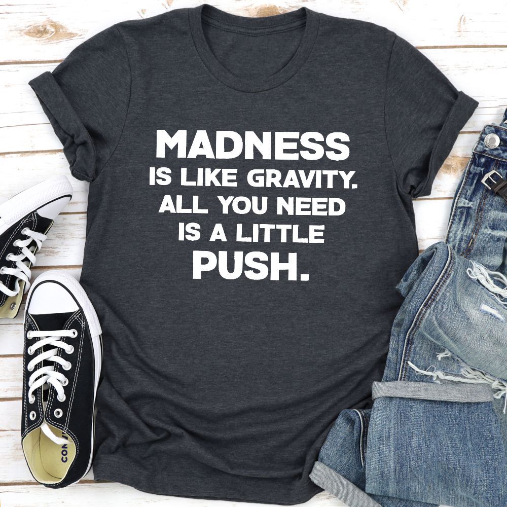 Madness Is Like Gravity T-Shirt displayed on a mannequin, showcasing its soft cotton fabric and vibrant print.