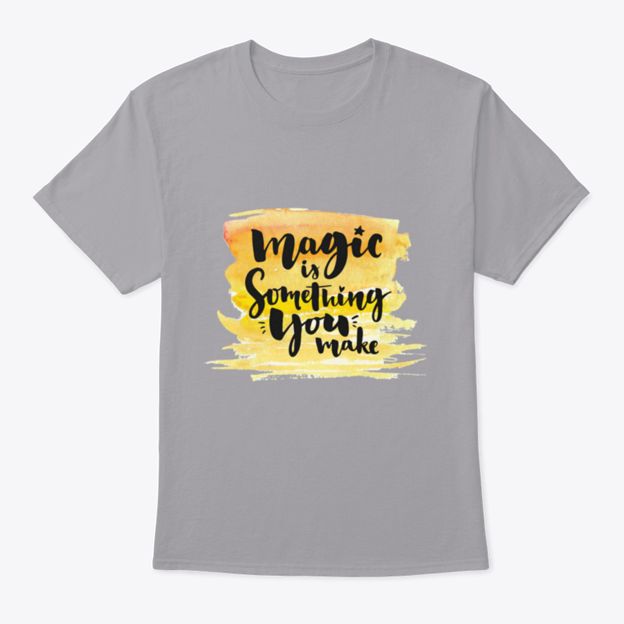 A vibrant yellow watercolor background featuring the phrase 'Magic Is Something You Make' in elegant brush lettering, showcasing creativity and artistic expression.