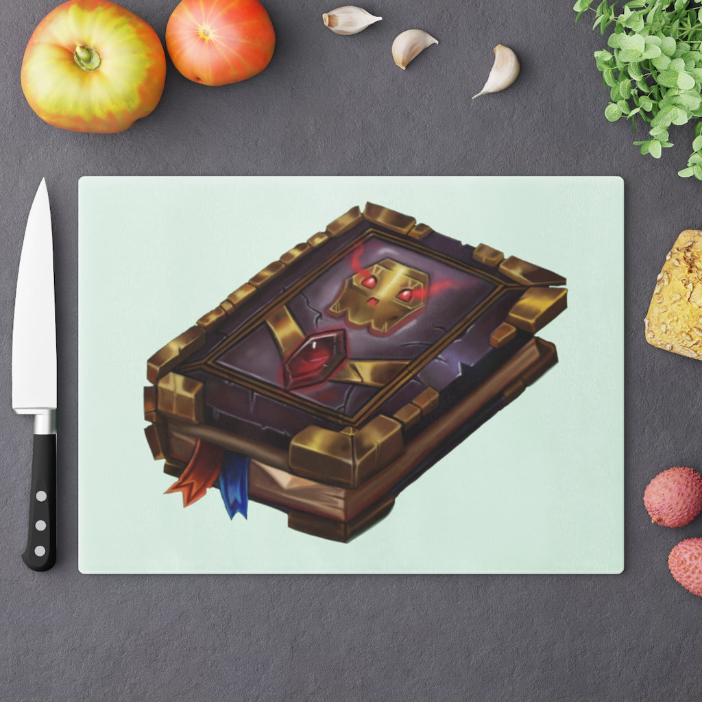 Magic Spell Book Cutting Board made of tempered glass with rubber dots for stability, featuring a whimsical spell book design.