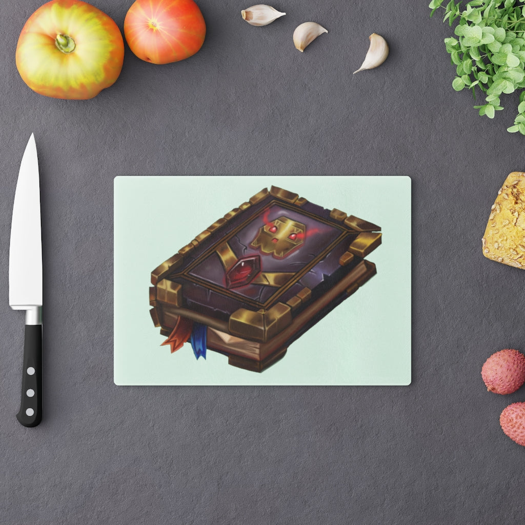 Magic Spell Book Cutting Board made of tempered glass with rubber dots for stability, featuring a whimsical spell book design.