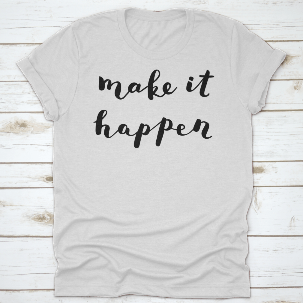 A comfortable t-shirt featuring the inspiring quote 'Make It Happen' in brush hand lettering style, made from high-quality cotton.