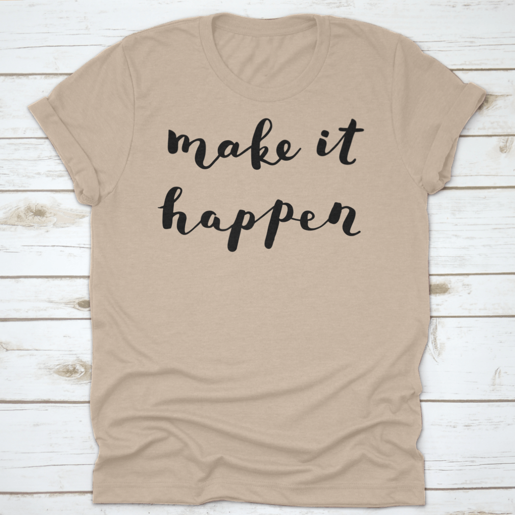 A comfortable t-shirt featuring the inspiring quote 'Make It Happen' in brush hand lettering style, made from high-quality cotton.