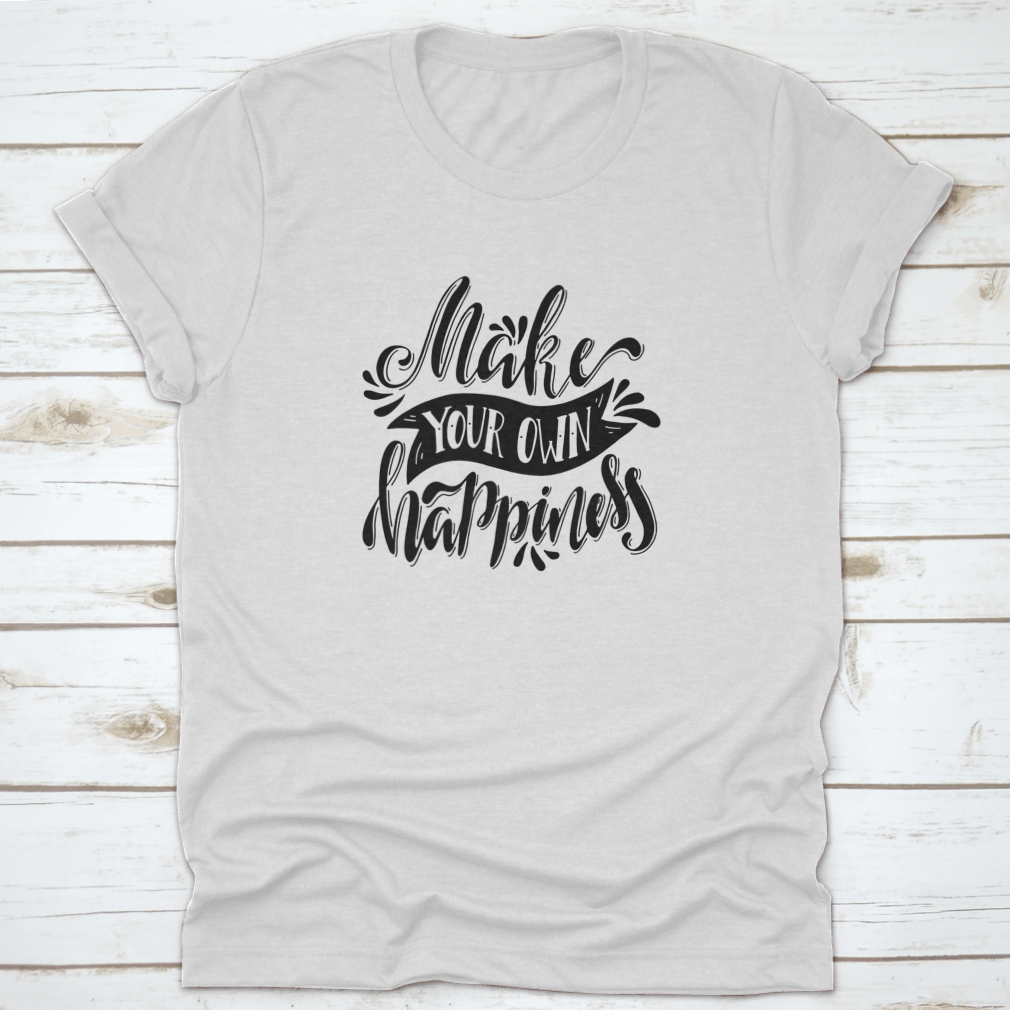 A stylish t-shirt featuring a hand-drawn illustration with the quote 'Make Your Own Happiness', showcasing a positive and uplifting design.