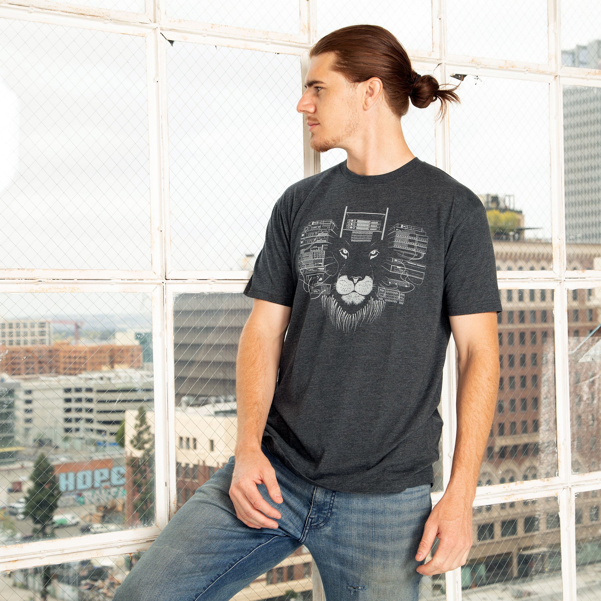 Charcoal grey Maneframe T-shirt featuring a bold lion graphic, designed for tech entrepreneurs.