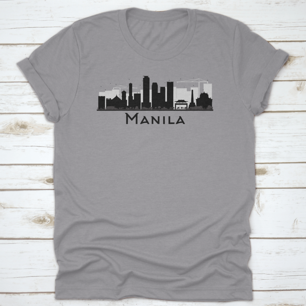 Black and white silhouette of Manila City skyline on a stylish T-shirt, showcasing iconic buildings in a minimalist design.