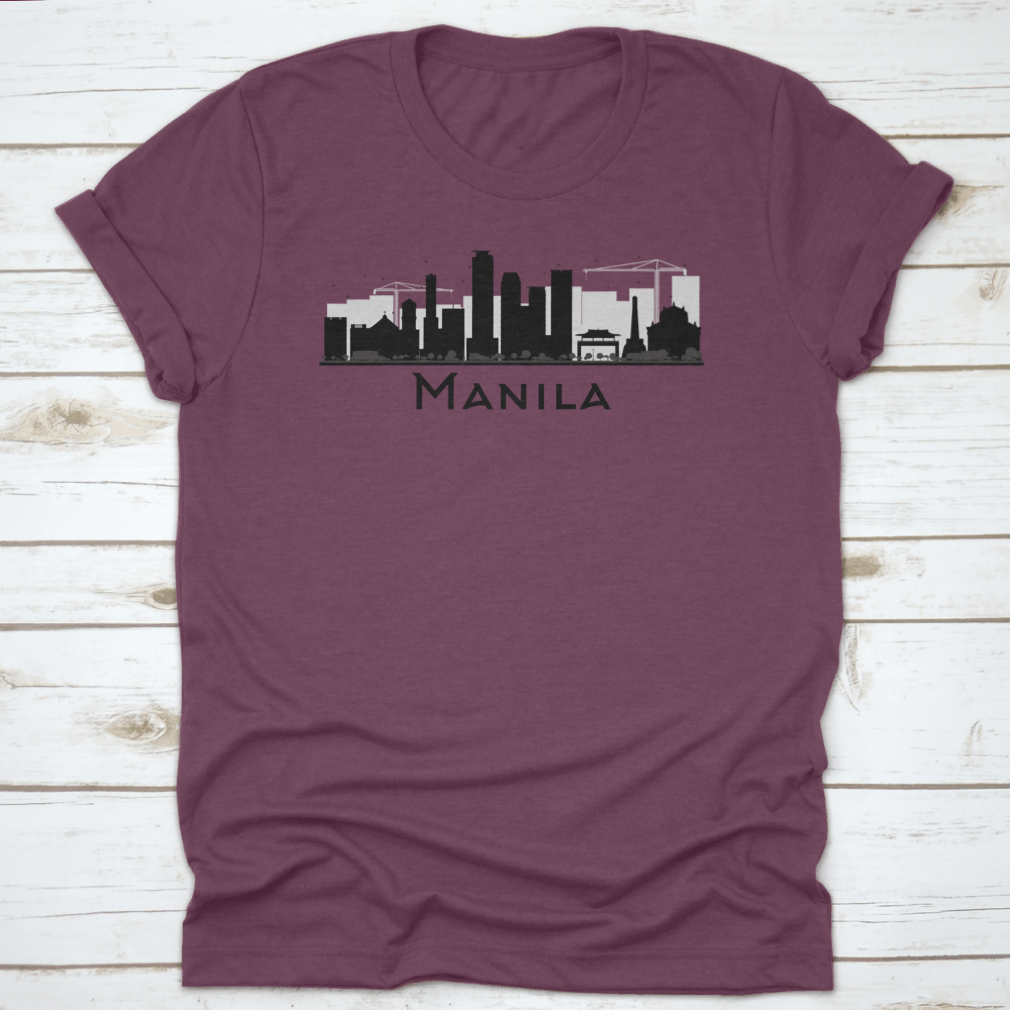 Black and white silhouette of Manila City skyline on a stylish T-shirt, showcasing iconic buildings in a minimalist design.