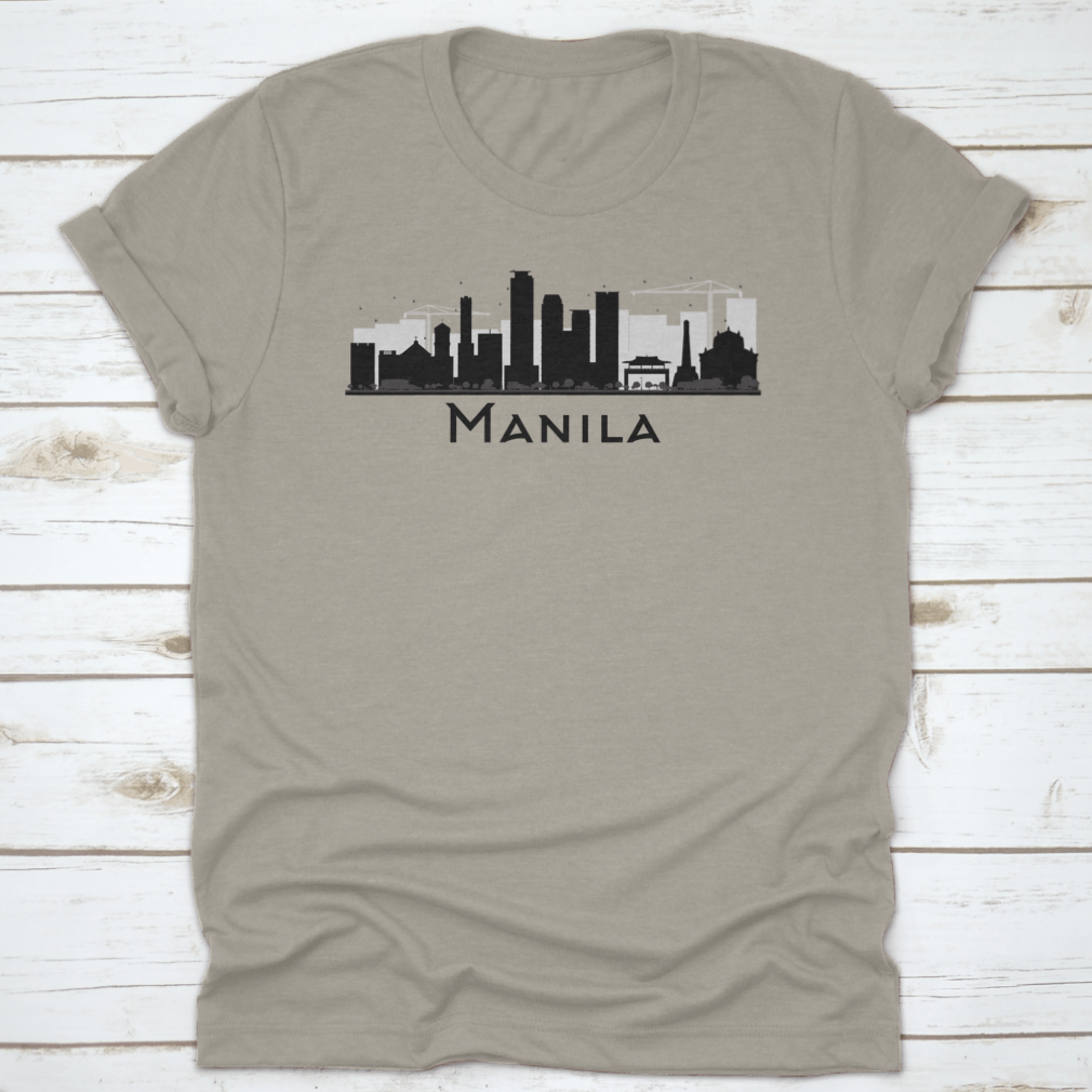 Black and white silhouette of Manila City skyline on a stylish T-shirt, showcasing iconic buildings in a minimalist design.