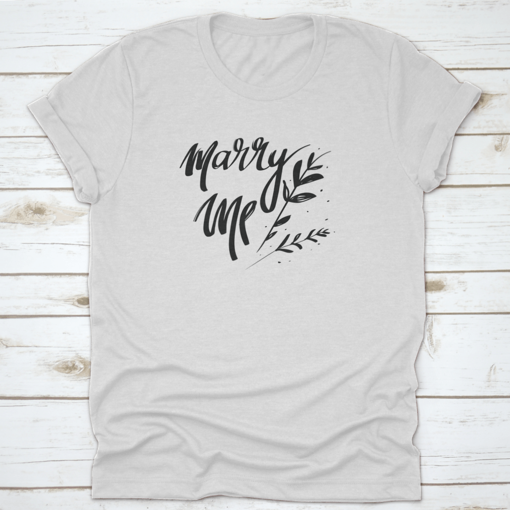 A stylish cotton t-shirt featuring romantic 'Marry Me' typography, perfect for young couples.