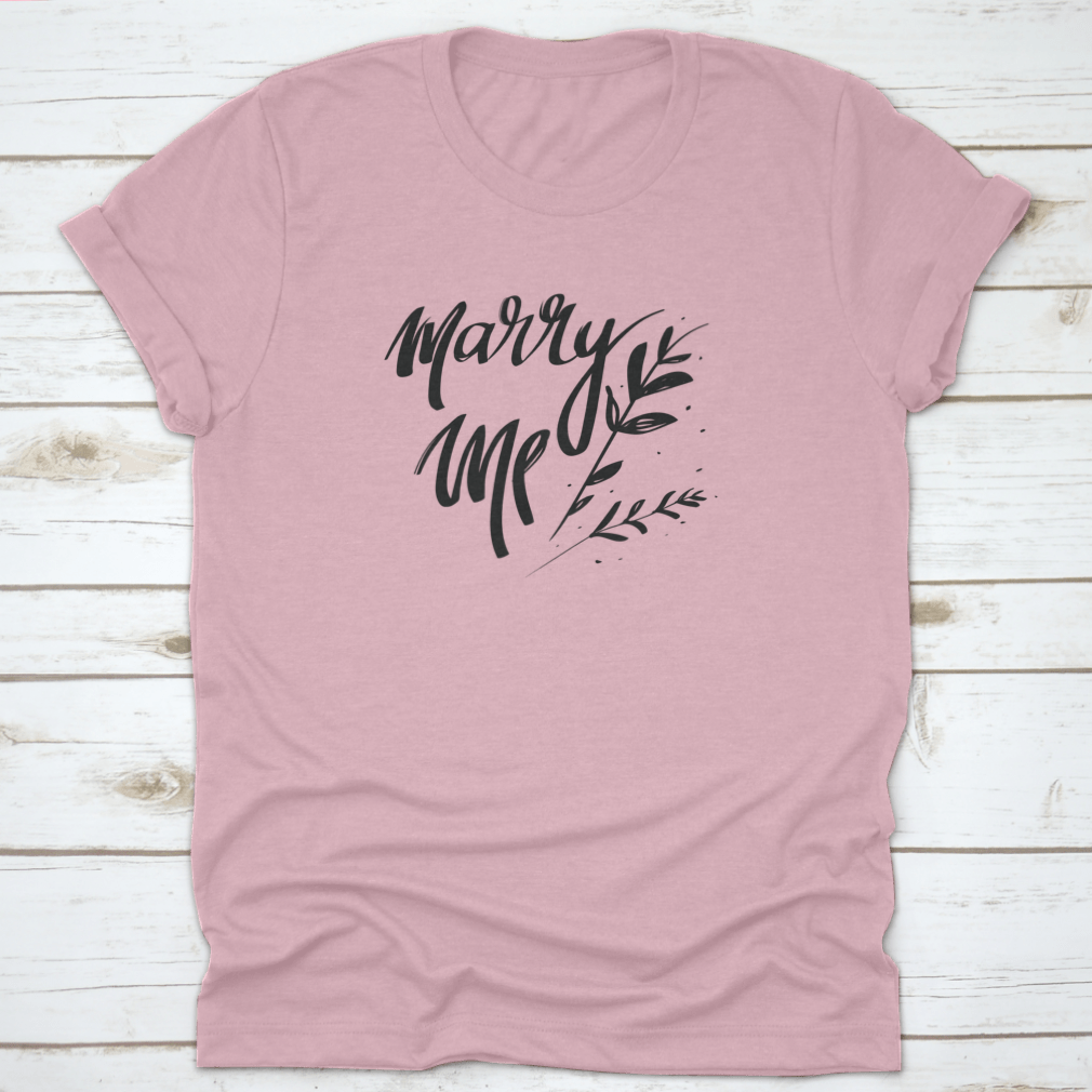 A stylish cotton t-shirt featuring romantic 'Marry Me' typography, perfect for young couples.