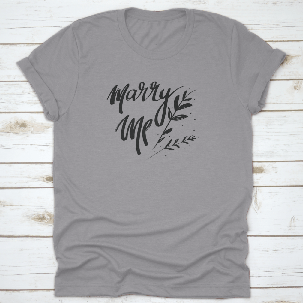 A stylish cotton t-shirt featuring romantic 'Marry Me' typography, perfect for young couples.