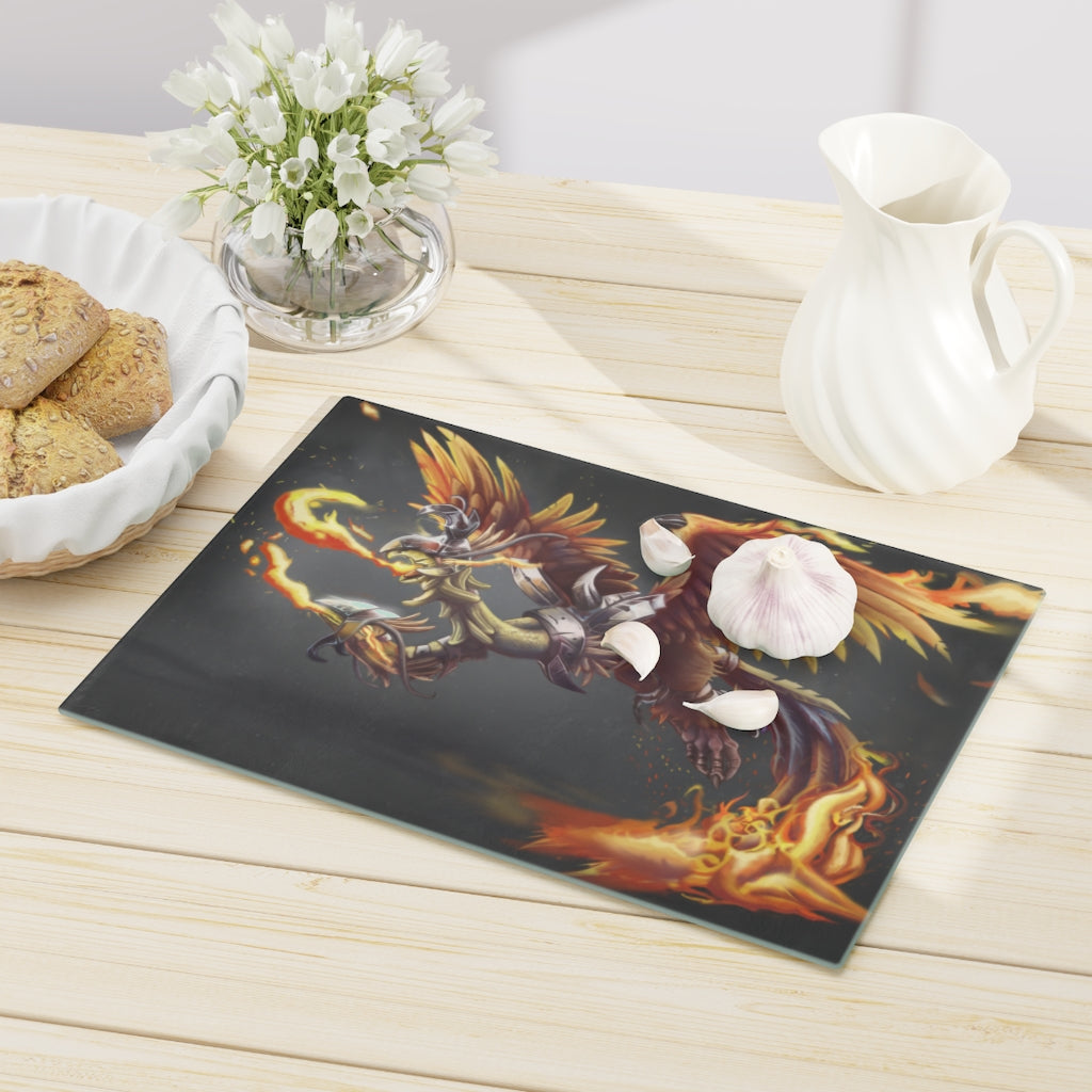 Merciless the Flaming SkyBird Cutting Board made of tempered glass with a vibrant flaming design and rubber dots for stability.