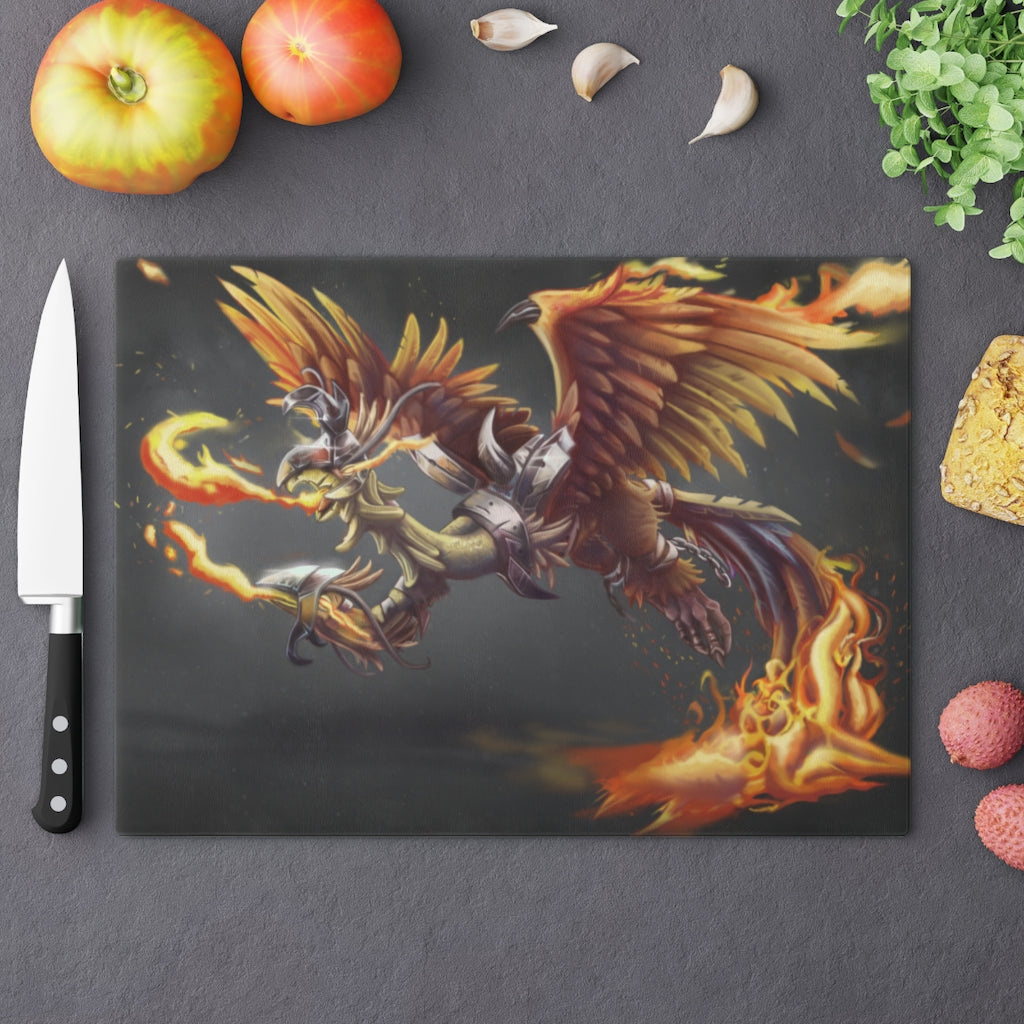 Merciless the Flaming SkyBird Cutting Board made of tempered glass with a vibrant flaming design and rubber dots for stability.