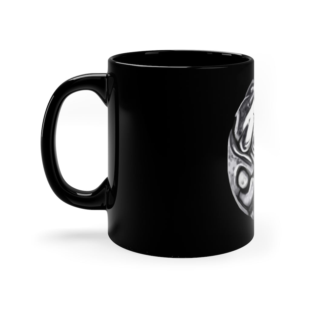 A sleek 11oz black ceramic mug with a C-handle, perfect for coffee, tea, or hot chocolate, showcasing customizable designs.