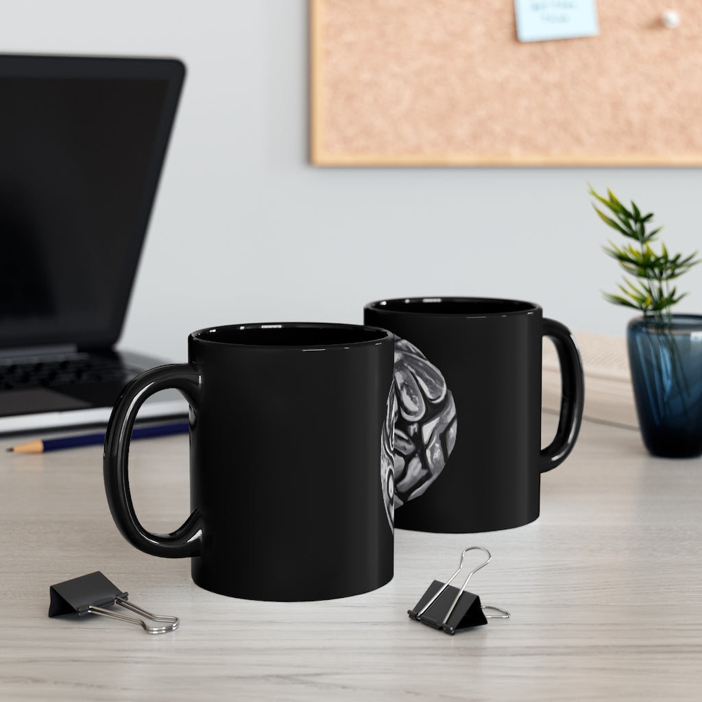 A sleek 11oz black ceramic mug with a C-handle, perfect for coffee, tea, or hot chocolate, showcasing customizable designs.