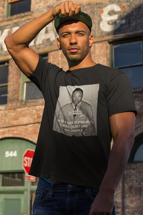 MLK Mugshot Quote T-Shirt featuring a powerful quote and striking design, made from soft ring-spun cotton.