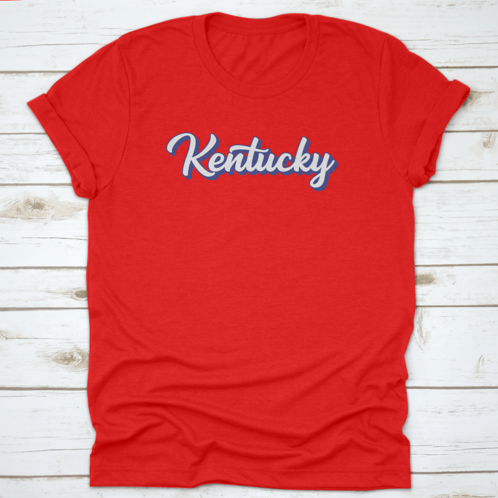 Modern blue hand lettering design of the state name Kentucky on a comfortable cotton shirt.