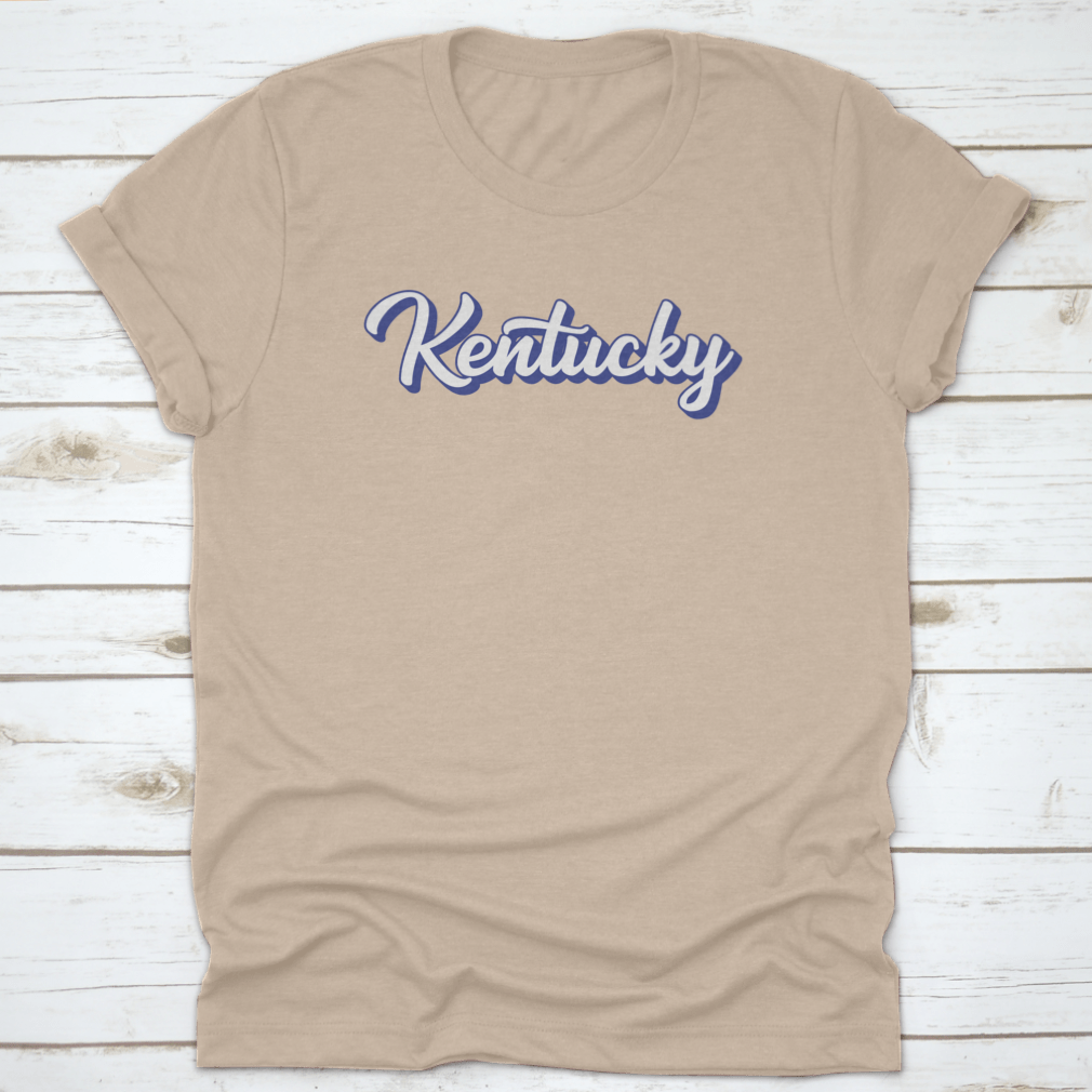 Modern blue hand lettering design of the state name Kentucky on a comfortable cotton shirt.