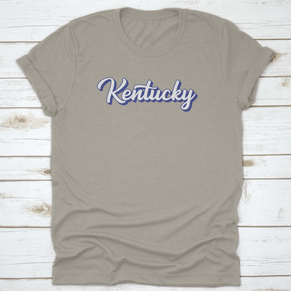 Modern blue hand lettering design of the state name Kentucky on a comfortable cotton shirt.