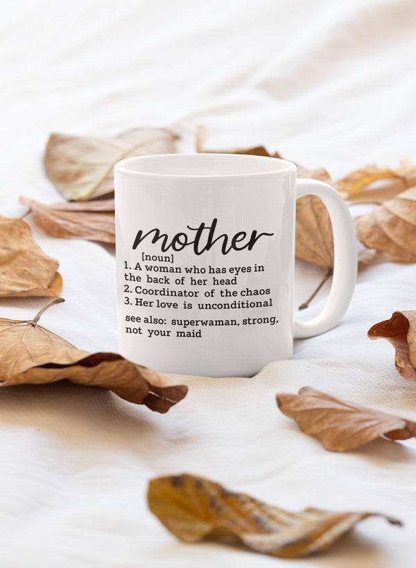 A stylish 11oz ceramic mug with a glossy finish, featuring the phrase 'Mother Noun' and a sturdy handle, perfect for coffee or tea.