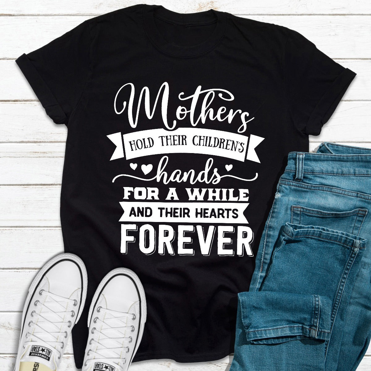 A soft and durable t-shirt featuring the phrase 'Mothers Hold Their Children's Hands For A While', perfect for mothers.