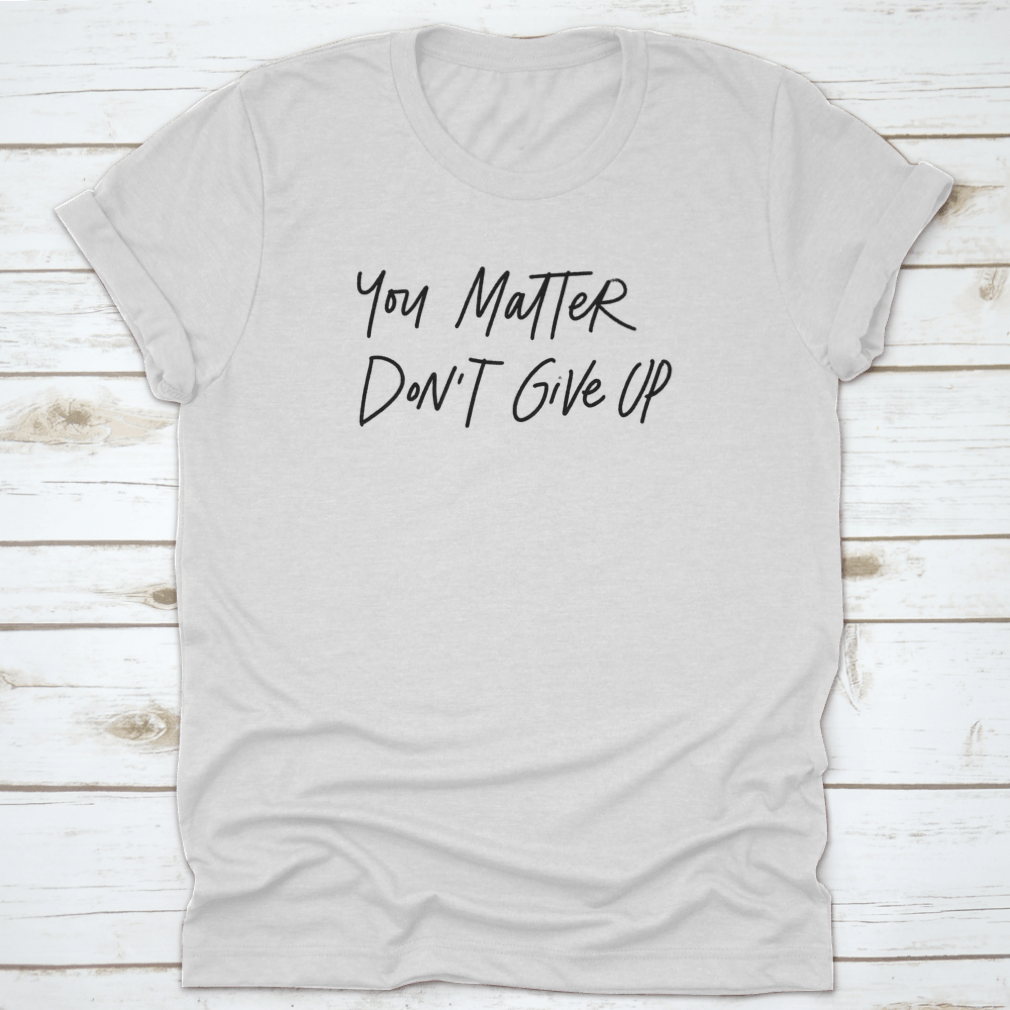 Motivational hand lettering phrase 'You Matter. Do Not Give Up' on a soft cotton fabric, showcasing its inspirational design.