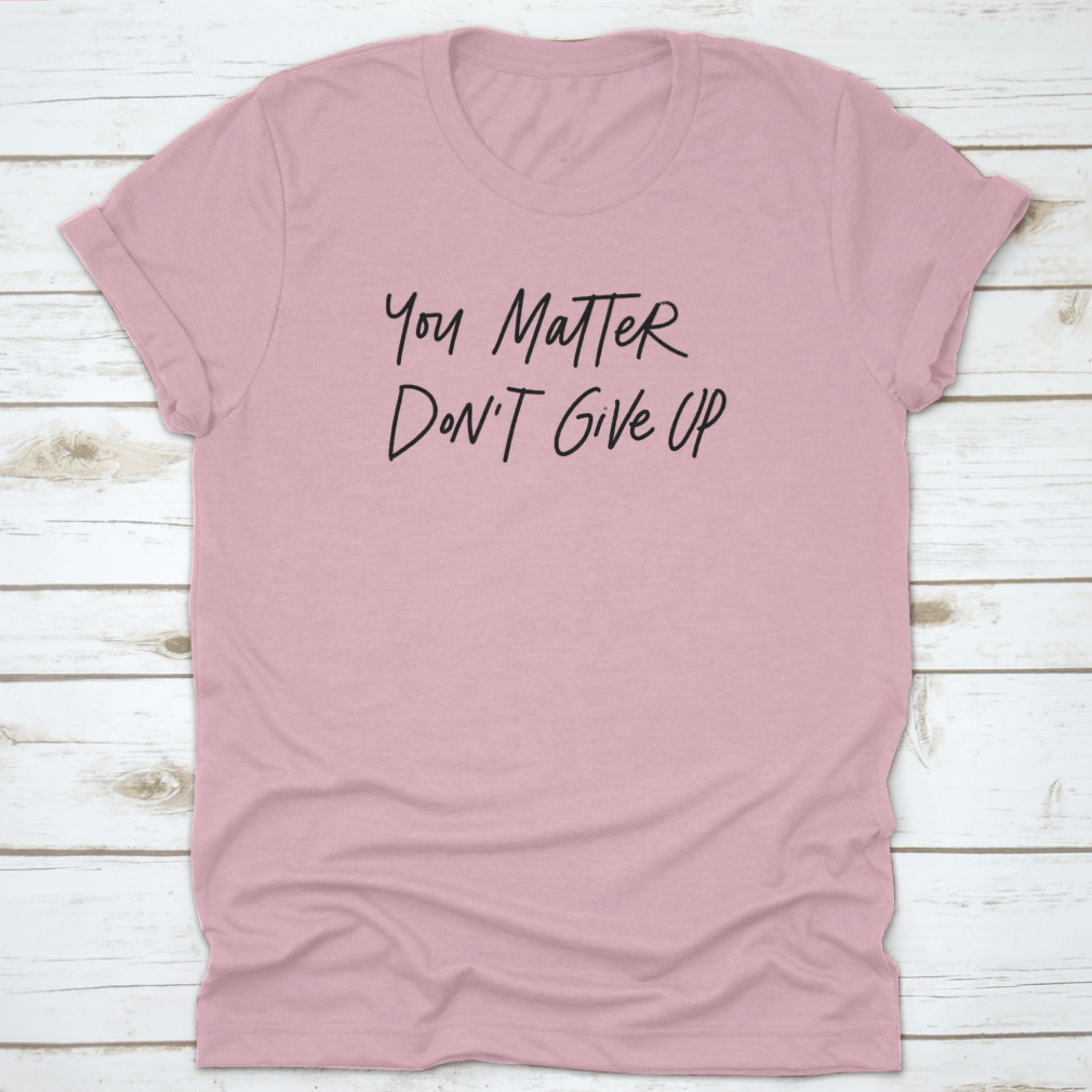 Motivational hand lettering phrase 'You Matter. Do Not Give Up' on a soft cotton fabric, showcasing its inspirational design.