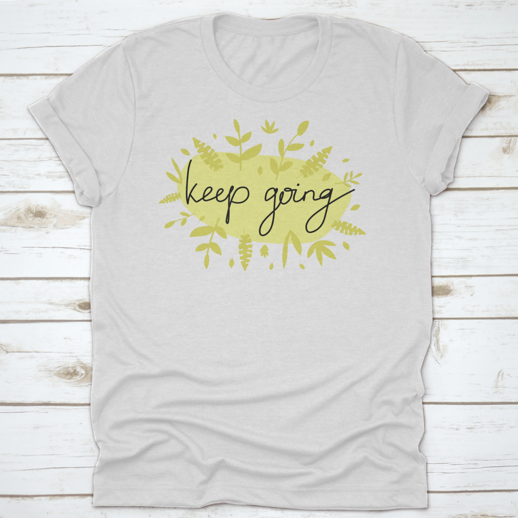 A stylish Motivational Message T-Shirt featuring modern lettering that says 'Keep Going', made from soft cotton fabric.