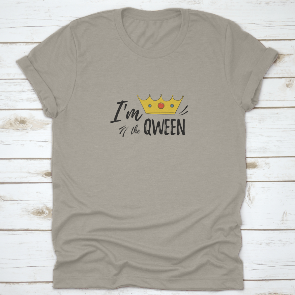 A stylish women's shirt featuring the motivational text 'I'M Qween' with a crown design, made from soft cotton fabric.