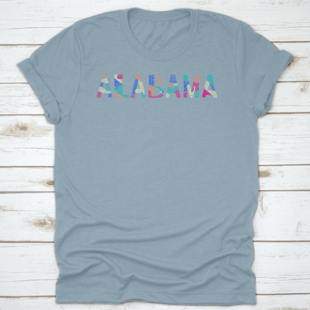 A vibrant multicolor T-shirt featuring a bright doodle design with patterned curves and crooked letters, showcasing a playful and artistic style.