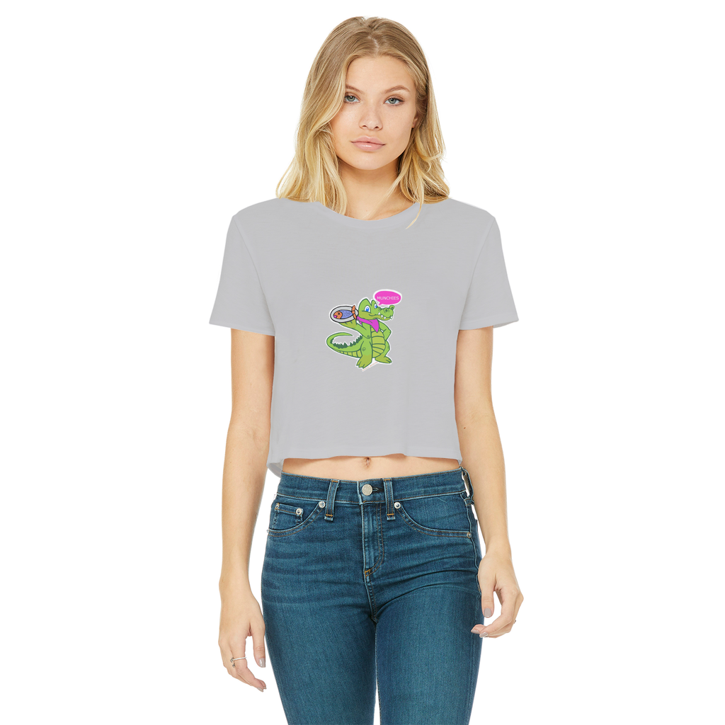 Munchies the Crocodile Classic Women's Cropped Raw Edge T-Shirt in various colors, showcasing its stylish design and raw edge hem.