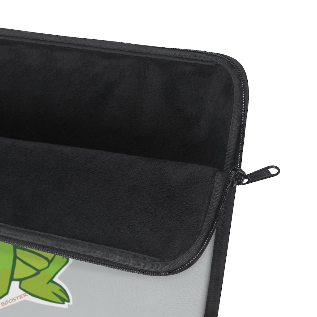 Munchies the Crocodile Laptop Sleeve featuring a stylish crocodile print on one side with a black backside and zipper.