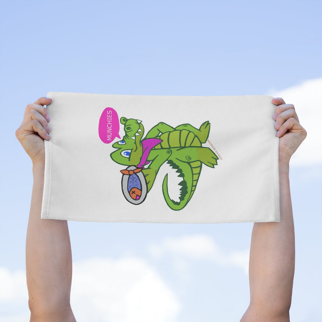 Munchies the Crocodile Rally Towel featuring a vibrant crocodile design, soft polyester front, and absorbent cotton backing, measuring 11x18 inches.