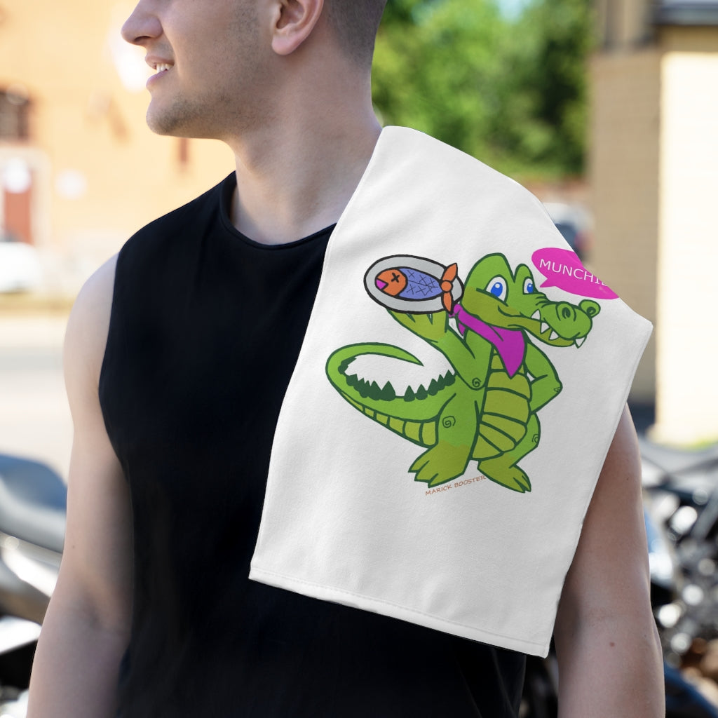 Munchies the Crocodile Rally Towel featuring a vibrant crocodile design, soft polyester front, and absorbent cotton backing, measuring 11x18 inches.