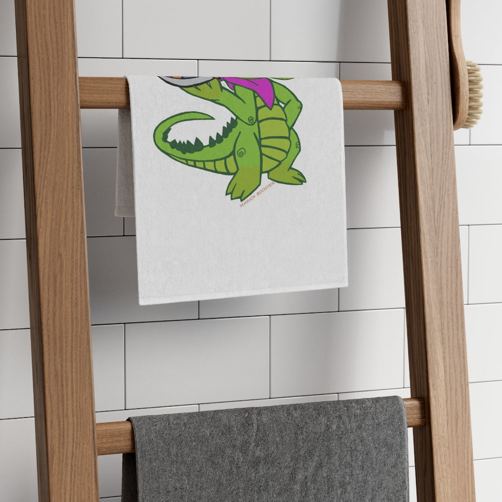 Munchies the Crocodile Rally Towel featuring a vibrant crocodile design, soft polyester front, and absorbent cotton backing, measuring 11x18 inches.