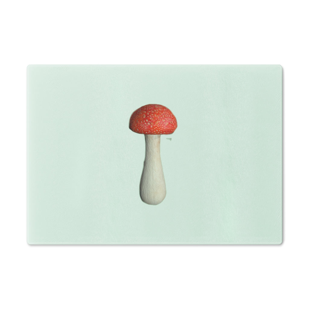 A stylish mushroom-themed tempered glass cutting board with rubber dots for stability, perfect for kitchen use.