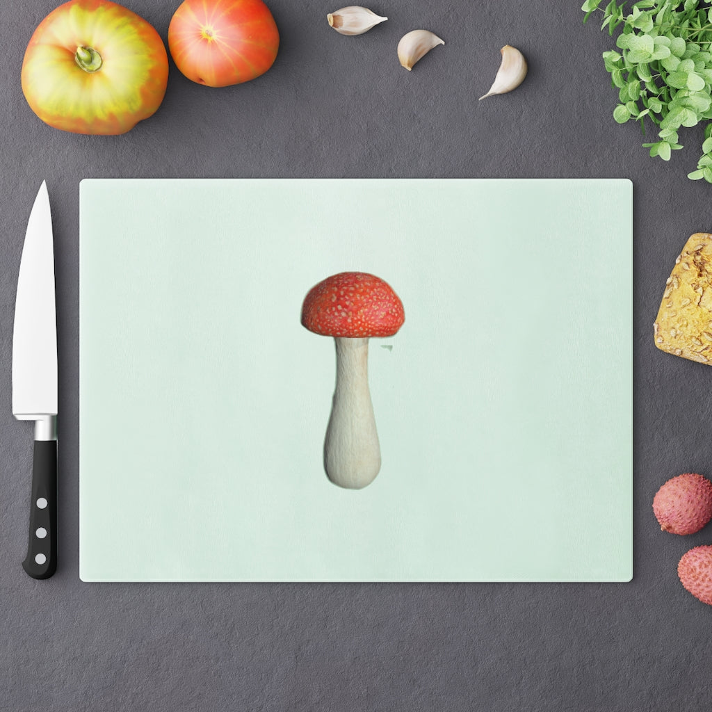 A stylish mushroom-themed tempered glass cutting board with rubber dots for stability, perfect for kitchen use.