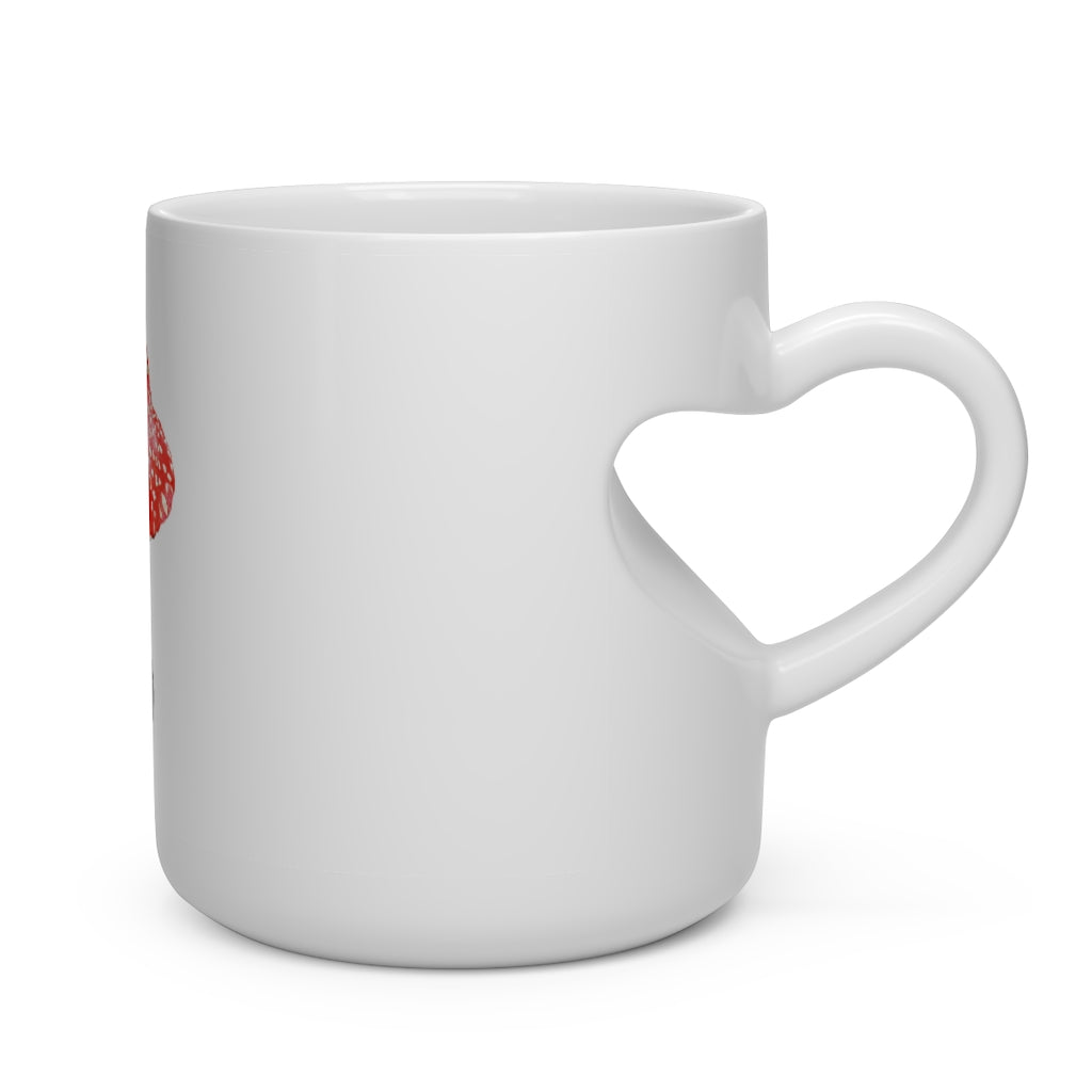 A white ceramic mug shaped like a heart with a heart-shaped handle, perfect for hot beverages.