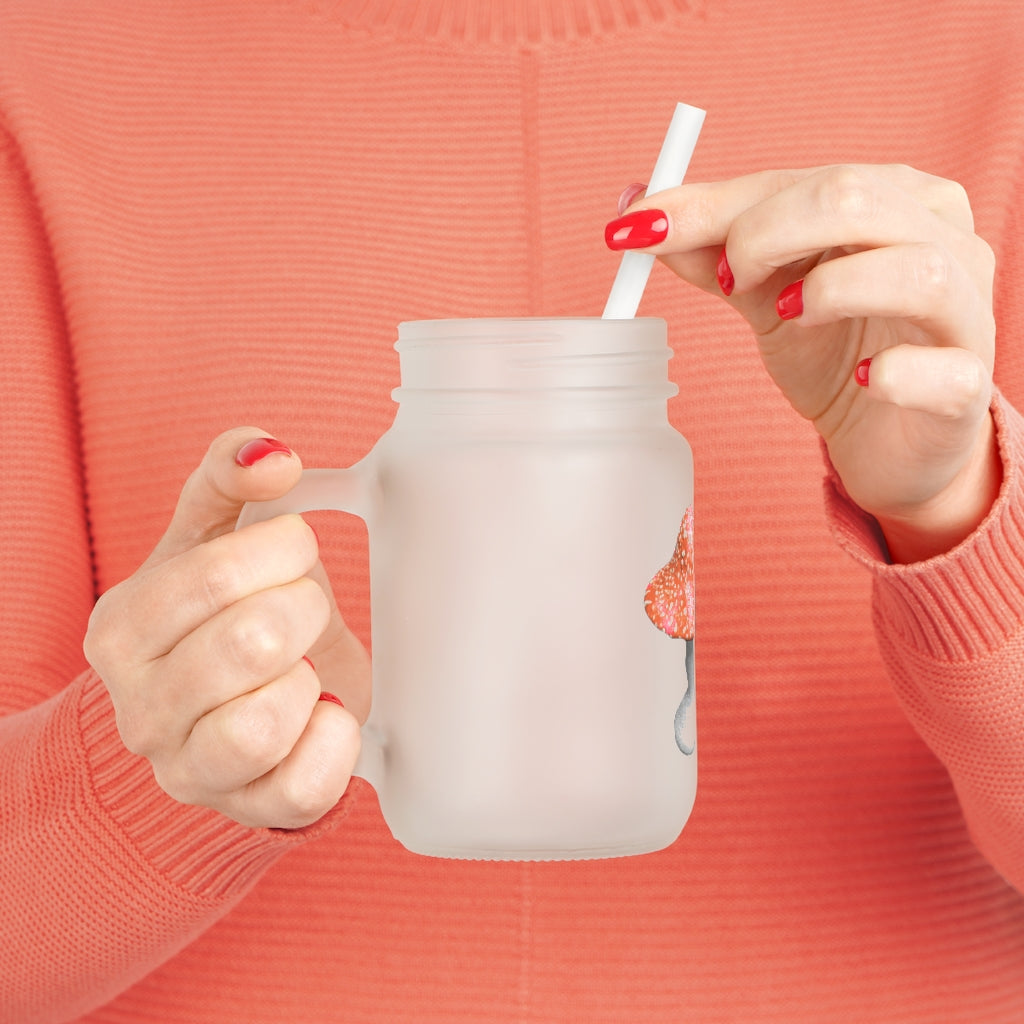 A stylish 16oz Mushroom Mason Jar made of frosted glass, featuring a lid and straw, perfect for personalized drinks.