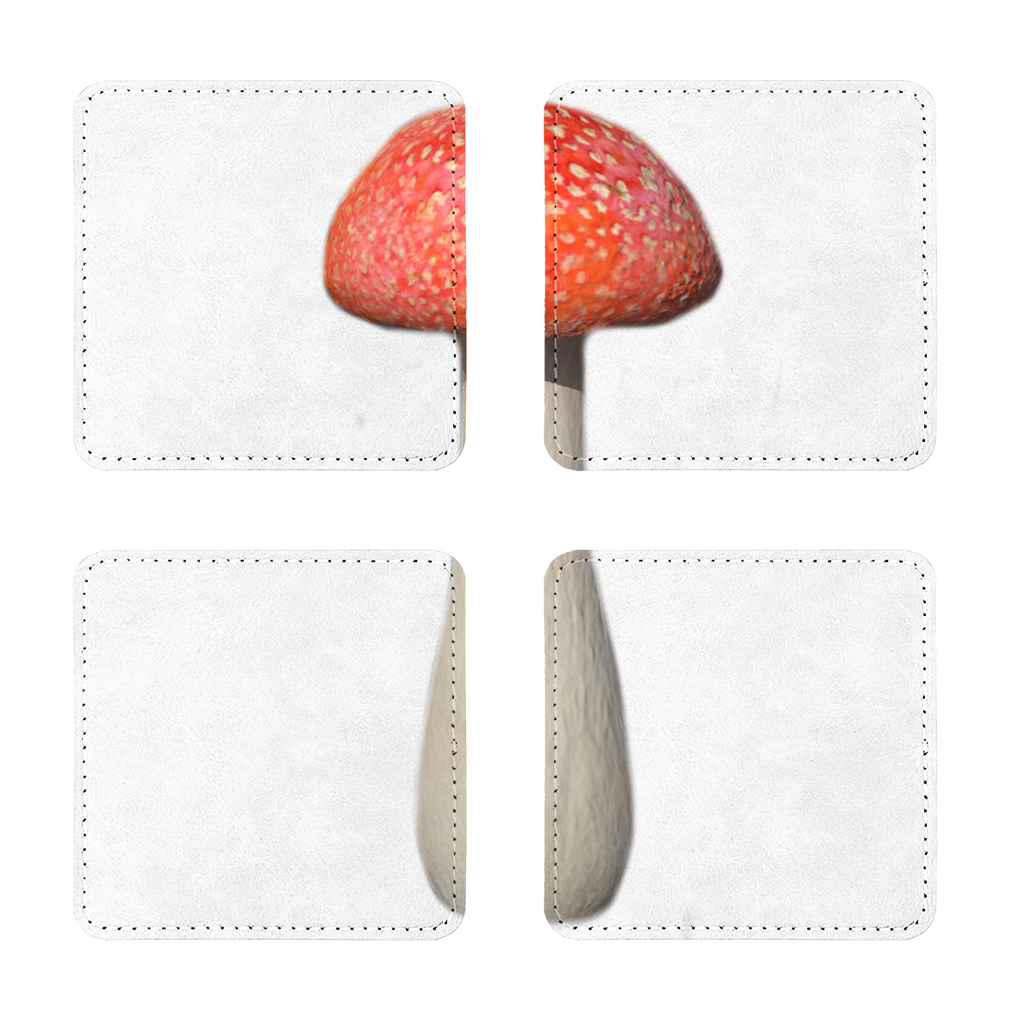 A pack of four mushroom sublimation coasters made from PU leather, featuring a white printable face and white stitching, displayed on a wooden table.