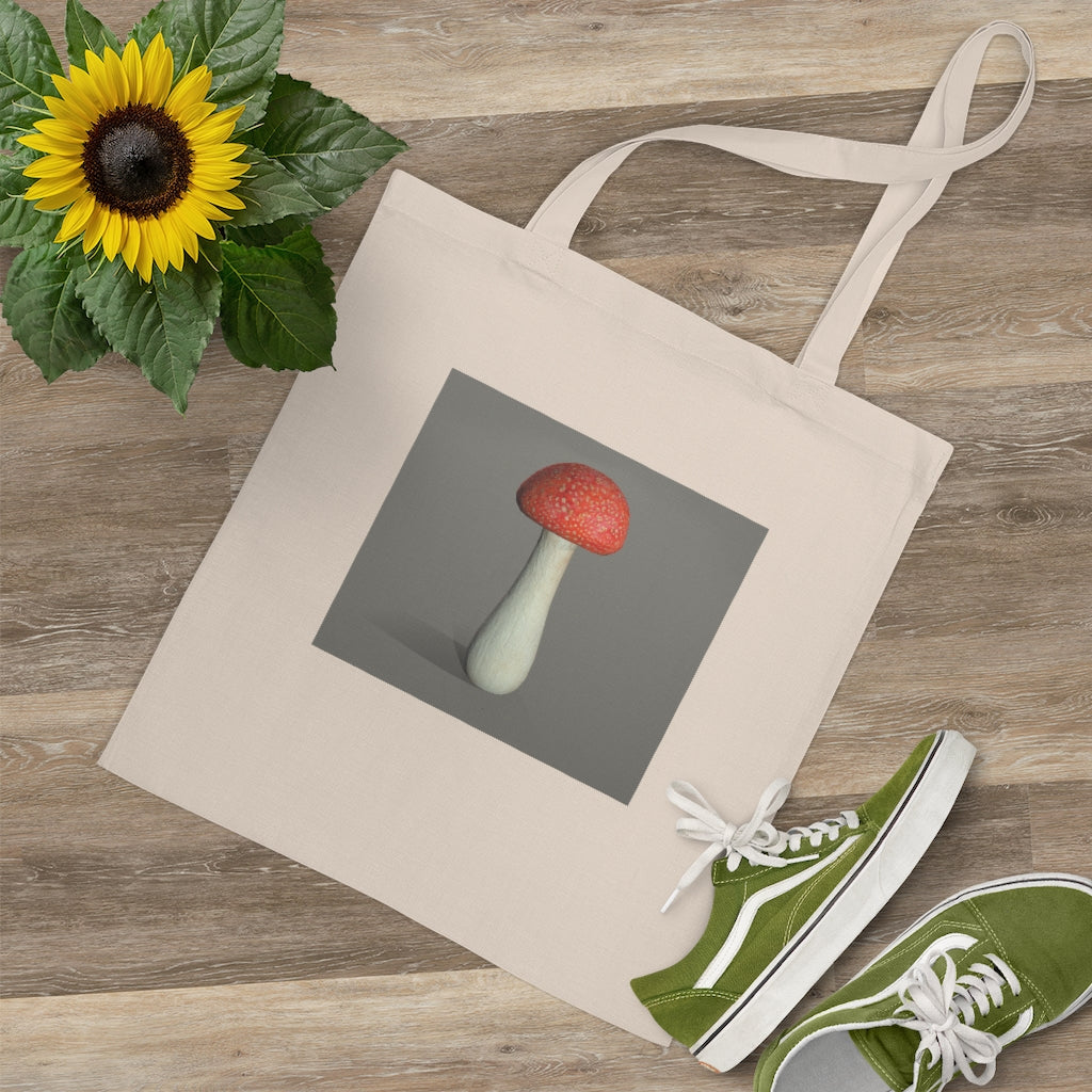 A colorful Mushroom Tote Bag made of 100% cotton with long handles and cross-stitched detailing.