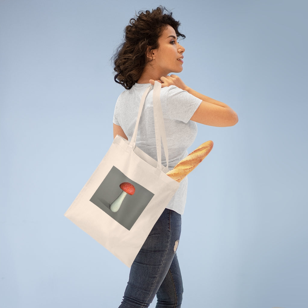 A colorful Mushroom Tote Bag made of 100% cotton with long handles and cross-stitched detailing.