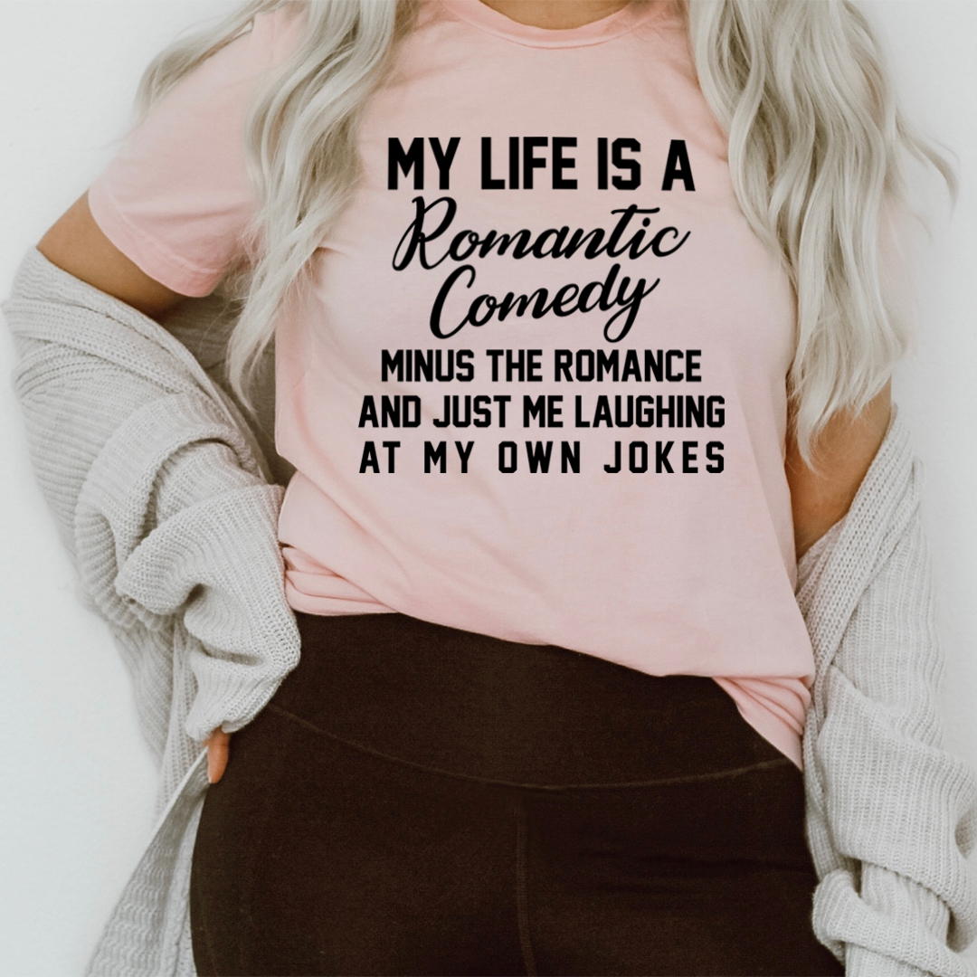 My Life Is A Romantic Comedy T-Shirt made of soft cotton, featuring a humorous print, available in various sizes.